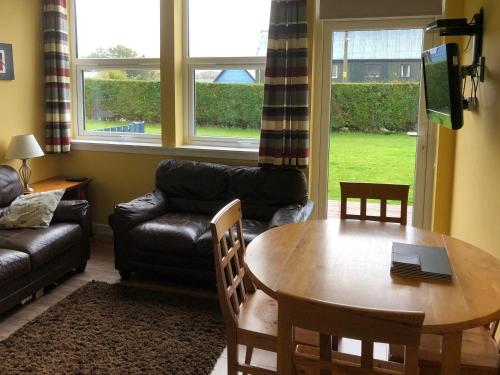 a living room with a table and a couch at Uk7522 - Science in Dallavich