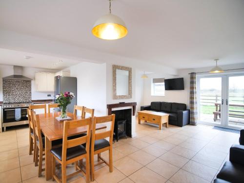 a kitchen and living room with a table and a couch at Cottage 6 - Ukc3183 in York