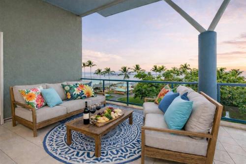 a living room with a couch and a table at 3BR Oceanfront Penthouse on The Strand, Townsville in North Ward