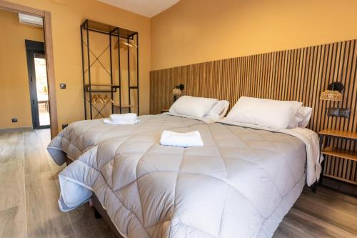 Llit o llits en una habitació de Ca La Padrina