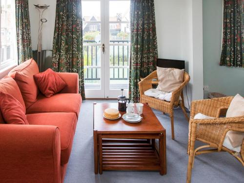 a living room with two couches and a coffee table at 1 Bell Lodge in Thorpeness