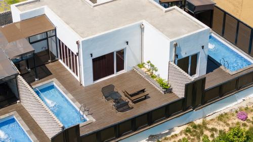 an aerial view of a house with a swimming pool at Buan Cordelia Pool Villa Pension in Buan