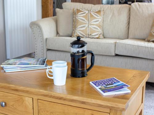 a coffee table with a coffee pot on top of it at Rivendale 7 in St. Andrews