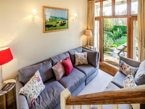 a living room with a couch and a window at Beachy Barn - Ukc6126 in Eastdean
