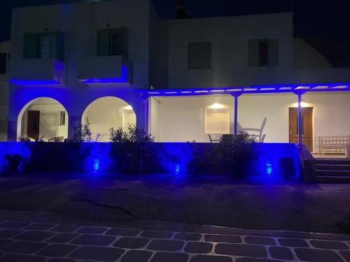a house with blue lights on it at night at SunΚissed Suite - Pollonia Milos in Pollonia