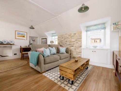 a living room with a couch and a table at Fishermans's Rest in Lossiemouth