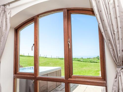 a room with a window with a view of a field at Beech Cottage - Ukc6252 in Linlithgow