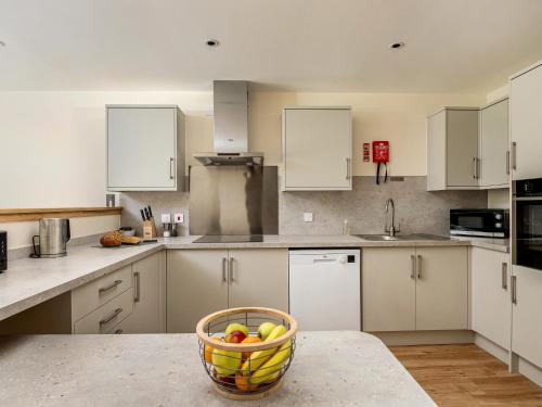 a kitchen with a bowl of fruit on a counter at Selkirk Lodge - Ukc5803 in Lundin Links