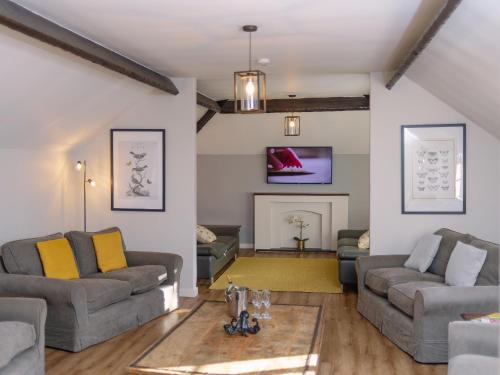 a living room with two couches and a fireplace at Number One - Ukc4963 in Tawstock