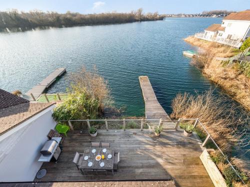 an aerial view of a dock on a lake at Wrens Lake House in South Cerney