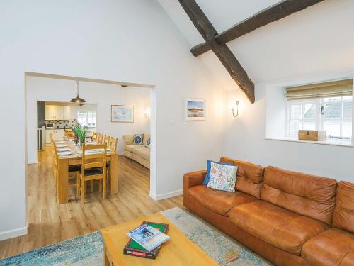 a living room with a couch and a dining room at Number Six - Ukc4968 in Tawstock
