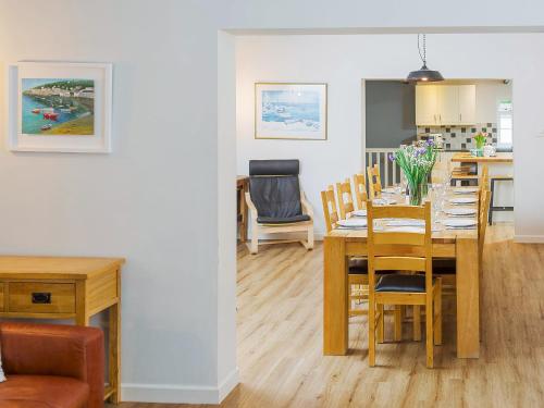 a dining room and kitchen with a table and chairs at Number Six - Ukc4968 in Tawstock