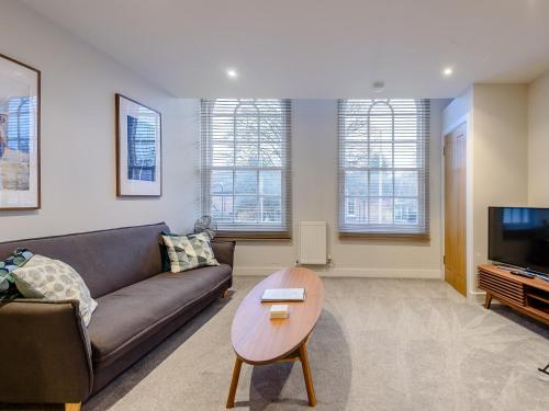 a living room with a couch and a table at 3 Eastgate - Uk34282 in Andover
