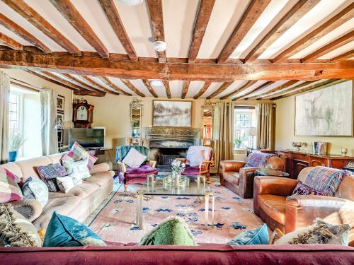a living room with a couch and a table at Croxton Park House in Croxton Kerrial