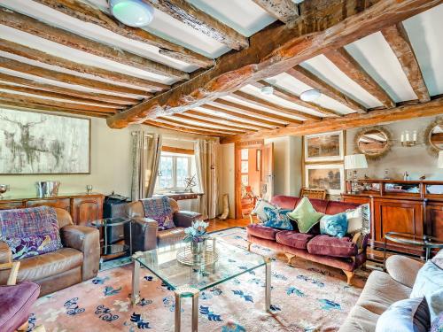 a living room with couches and a table at Croxton Park House in Croxton Kerrial