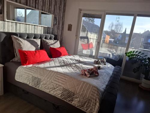 a dog laying on a bed in a bedroom at Dixi-Land in Tauche