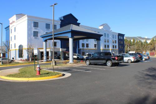 a parking lot with a red fire hydrant in front of a building at Comfort Suites Dulles Airport in Chantilly