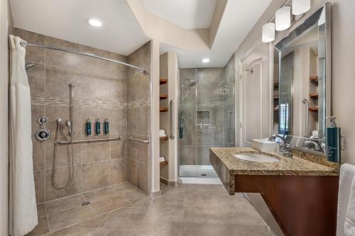 a bathroom with a shower and a sink at Hilton Vacation Club Scottsdale Villa Mirage in Scottsdale