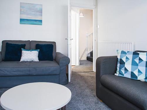 a living room with a couch and a table at Shirehampton Apartment in Shirehampton