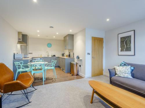 a living room with a couch and a table at 6 Eastgate -Uk34289 in Andover