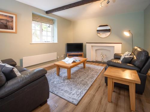 a living room with two couches and a fireplace at Number Eight - Ukc4971 in Tawstock