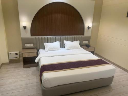 a bedroom with a large bed in a room at Agastya Resort in Bāri