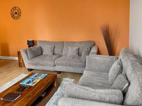 a living room with two couches and a coffee table at Moat House 6 - Ukc4889 in Fort Augustus