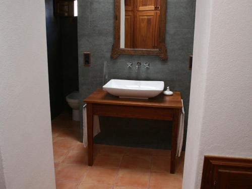 a bathroom with a sink and a mirror on a counter at Holiday Home in St Josep de sa Talaia with Pool in Sant Josep de sa Talaia