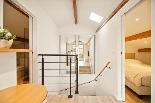 a room with a bed and a mirror at Saint Tropez High standing 3 in Saint-Tropez