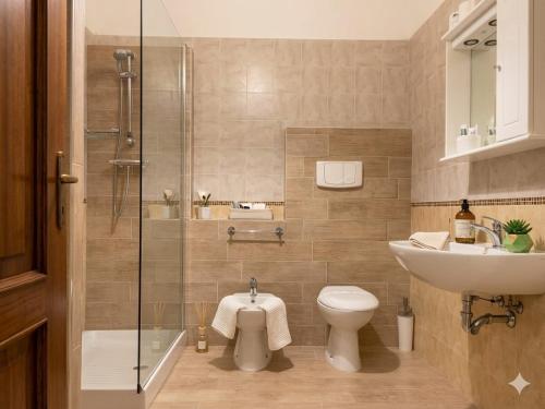 a bathroom with a sink and a toilet and a shower at VILLETTA 8 - Premium Villas in Giulianova
