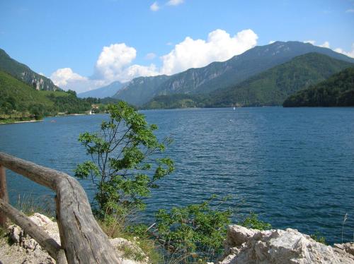 a view of a lake with mountains in the background at Hotel Sport in Ledro