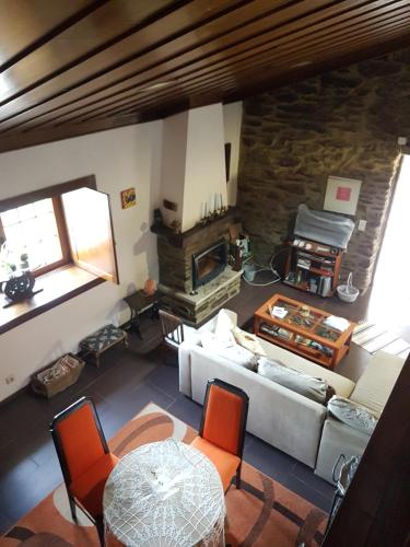 an overhead view of a living room with a fireplace at Casa da Zeza in Negreda