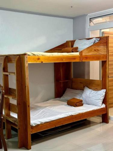a couple of bunk beds in a room at Your Quiet Home with Unbeatable location in Baguio