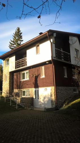 a large brick building with a balcony on it at Dušan in Štôla
