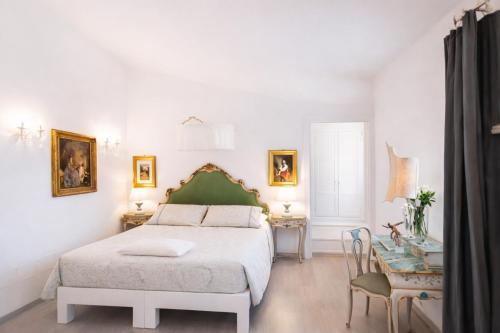 a bedroom with a bed and a table at Country Lodge B&B in Siena