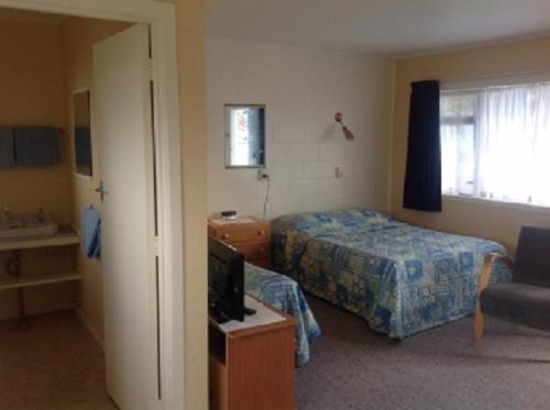 מיטה או מיטות בחדר ב-Dargaville Motel