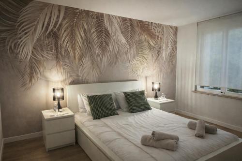 a bedroom with a large bed with two night stands at COSY LIVING in Huningue