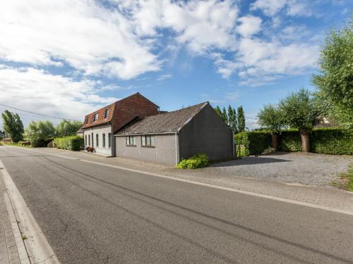 a house on the side of a road at In a quiet location nearby the woods in Ruiselede