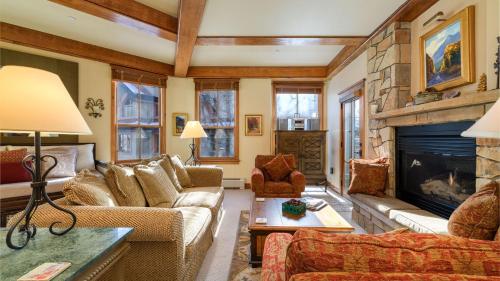a living room with couches and a fireplace at Palmyra 3D by AvantStay Gorgeous Condo in Great Location in Telluride
