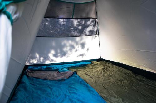 an inside view of a tent with a bed in it at Munich Oktoberfest Central Camping Village in Munich