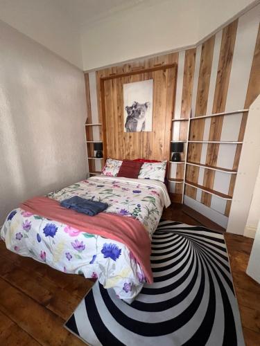 a bedroom with a bed and a rug at Seaside Sanctuary in Aspendale
