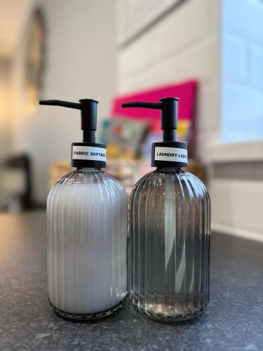 two bottles of soap sitting on top of a counter at Northwood 2 in Broadstairs