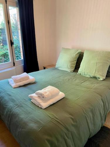 Llit o llits en una habitació de EasyHome 26