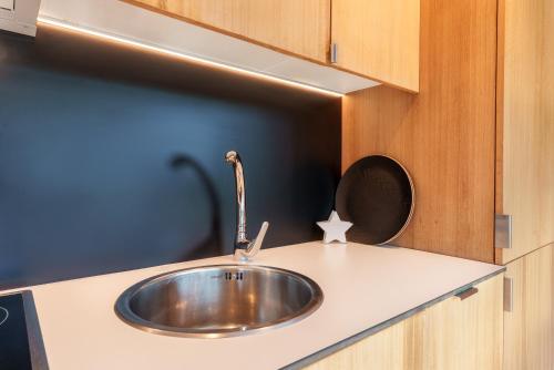 a stainless steel sink in a kitchen counter at Santi Cabodeiro in Isla de Arosa