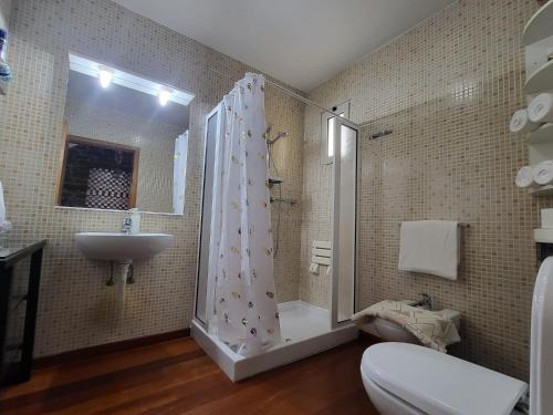 a bathroom with a shower and a sink at Boutique Chalet in Calheta in Arco da Calheta