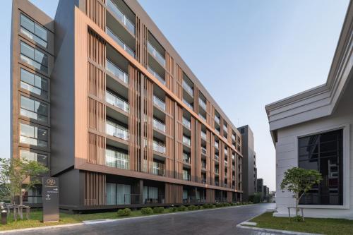 an external view of a building at Mandarin Eastville, Pattaya - SHA Extra Plus in North Pattaya
