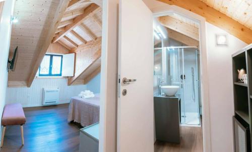 a bathroom with a shower and a sink in a room at Blue House Ponte de Lima in Ponte de Lima