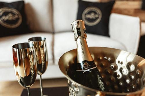 a bottle of champagne in a bucket on a table at StAnton Snow in Sankt Anton am Arlberg