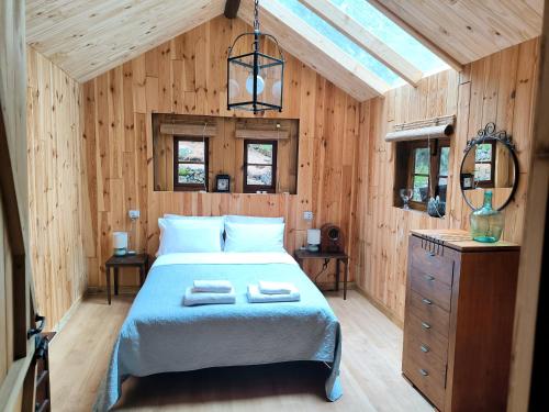 a bedroom with a bed with two towels on it at Buen Paso in Icod de los Vinos