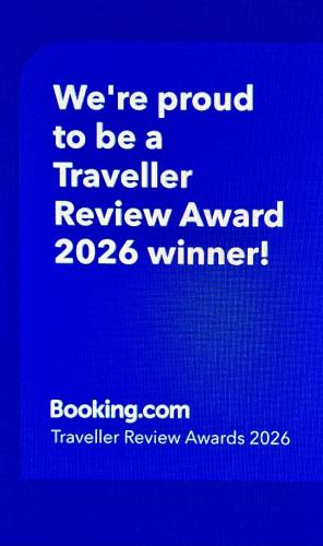a blue sign that says were proud to be a travelled review award winner at Stone Villa in Chayofa